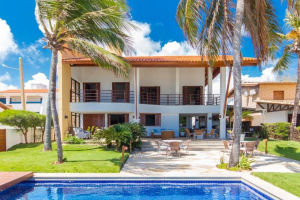 Discover a stunning beachfront villa in Porto Mirim, Brazil. 6 bedrooms, pool, high-end finishes, and ocean views. For sale at €5,800,000.