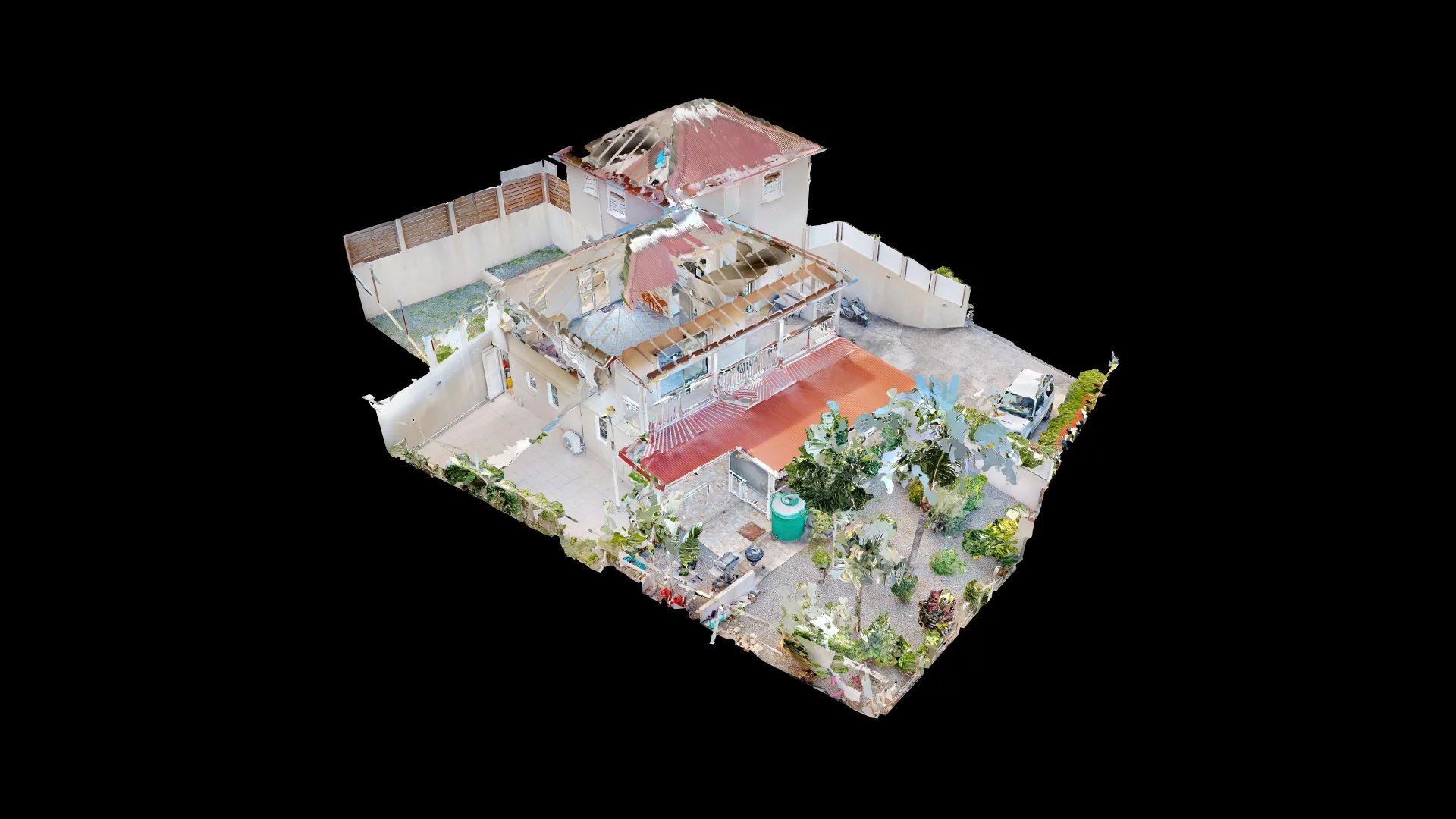 3D aerial view of a multi-building residential property with red roofs and a courtyard garden, isolated on a black background.