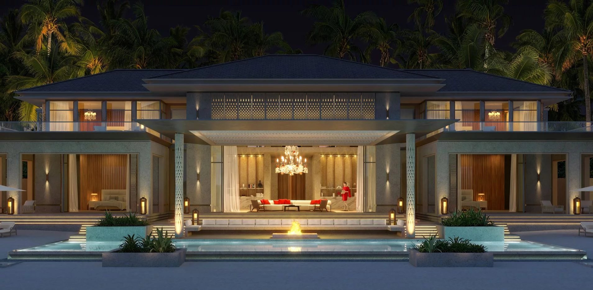 Luxurious modern villa at night with glass walls, warm interior lighting, and a central chandeliered living area seen through open doors.