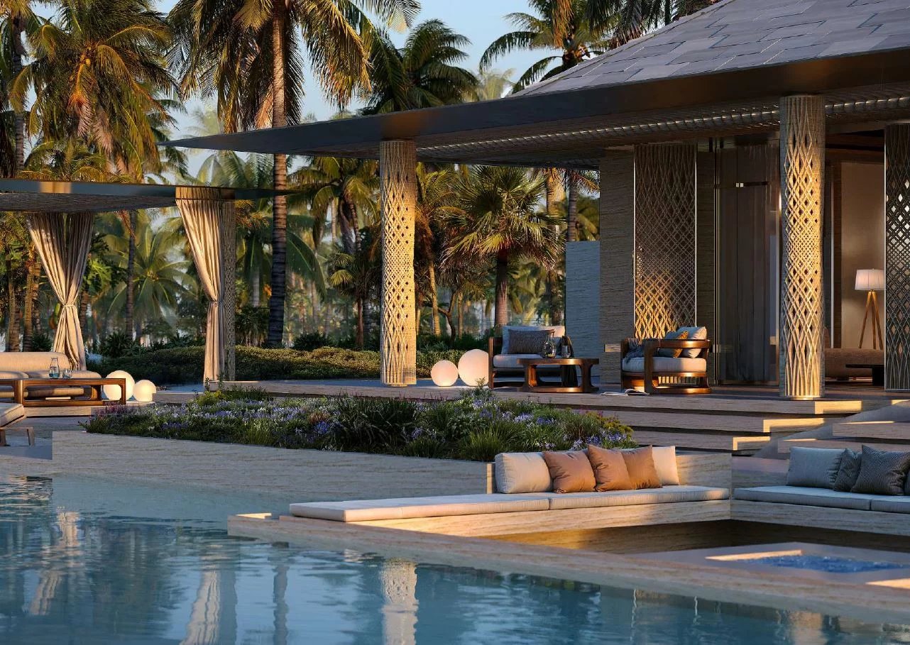 Luxurious poolside patio at sunset with palm trees, shaded seating, and modern columns.