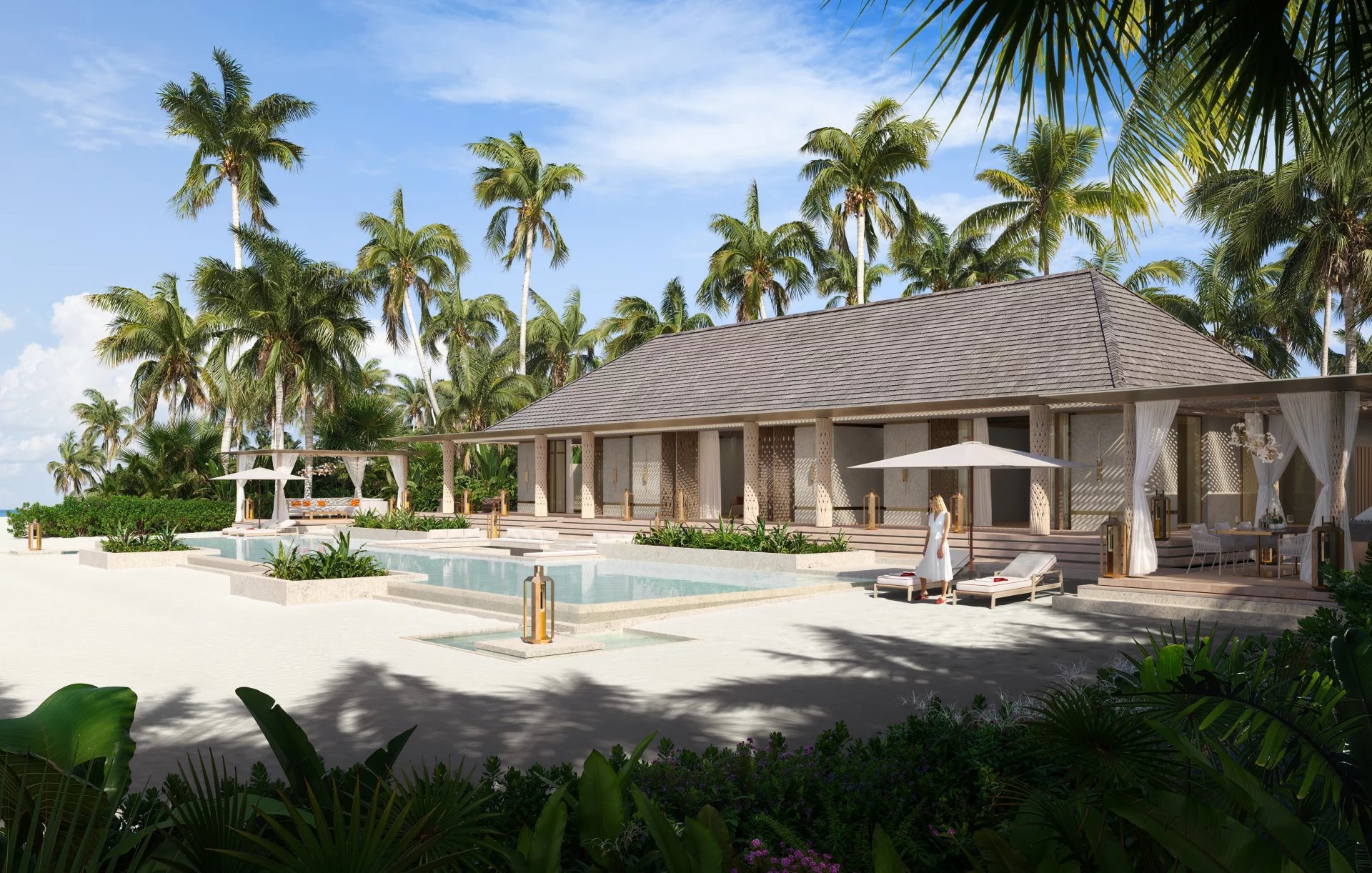Luxurious tropical resort with a central pool, lounge chairs, palm trees, and a thatched-roof building.